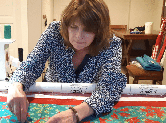 Bernadette Whalen working on quilt