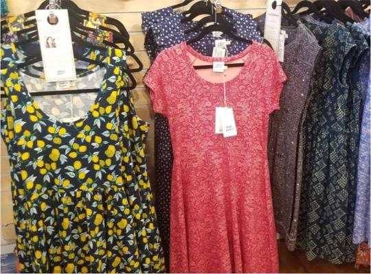 dresses hung on the wall at Posie Row