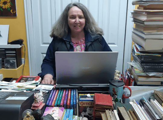 Elaine Janes at the laptop Elaines Books