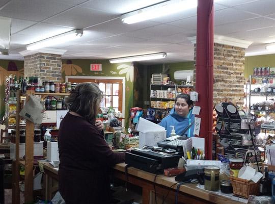 Nancy behind the counter at Food for Thought