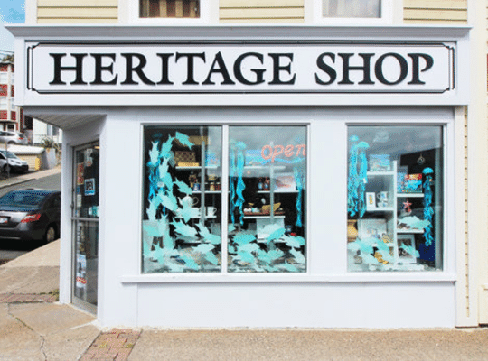 Heritage Shop on Duckworth Street with big windows and whales painted on them