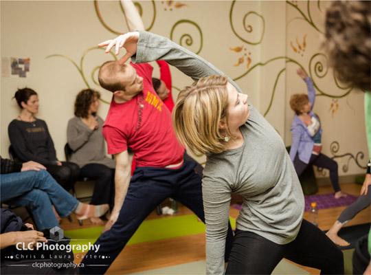 people practicing peaceful warrior pose at Yoga Kula Co-op CLC Photography photo