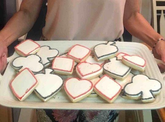 a tray of delicious diamond, heart, spade, and club-shaped cookies