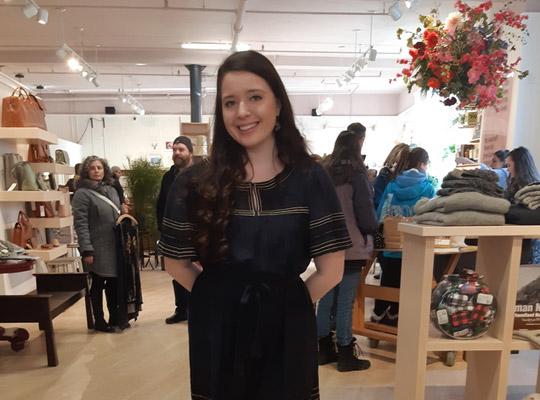 dark haired woman at Johnny Ruth wearing a black dress