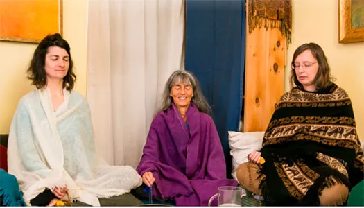 three women meditating