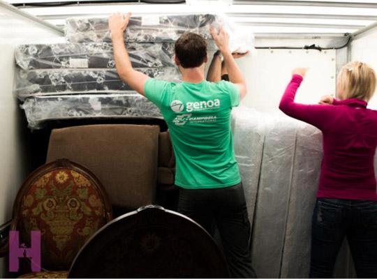 home again volunteers moving furniture in the van