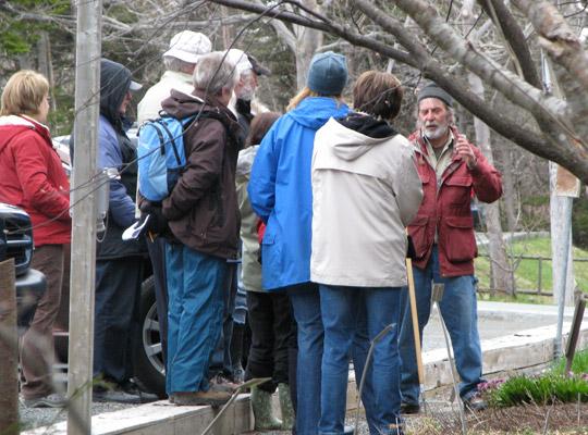 a group of people on a tour of MUN Botanical Gardens